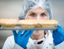 Lady holding pies at innovaiton centre