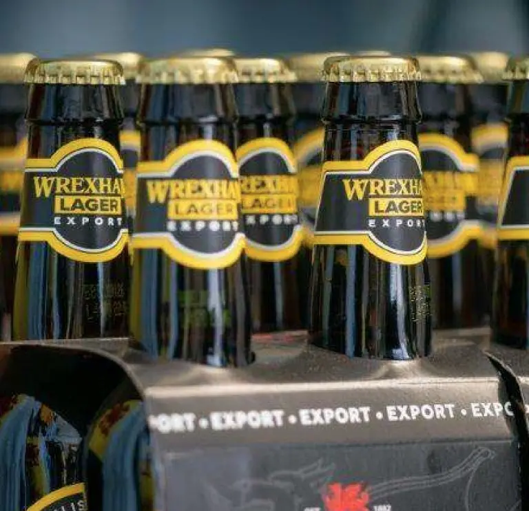 Four lots of four packs of wrexham lager in bottles