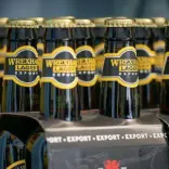 Four lots of four packs of wrexham lager in bottles